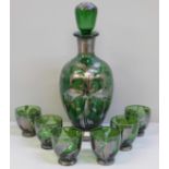 A green glass liqueur set; decanter with six glasses