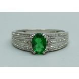 A 9ct white gold and green stone ring, 3.2g, O