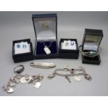 Silver jewellery including a charm bracelet, mother of pearl and silver bladed fruit knife, etc.