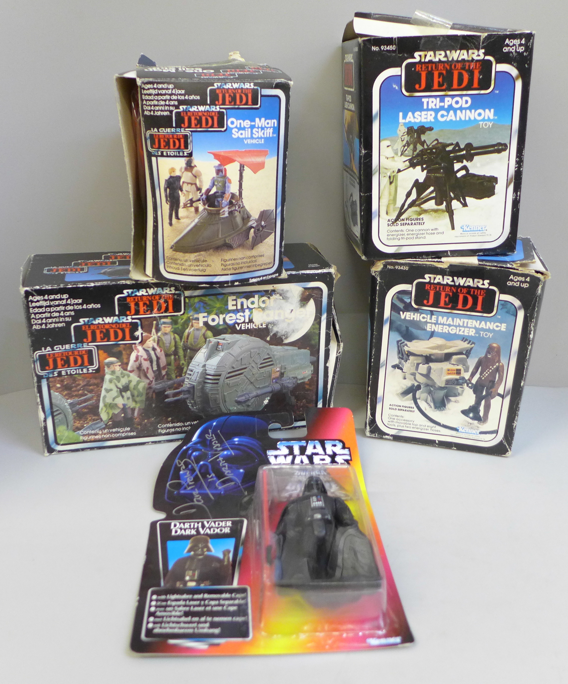 A 1995 sealed Darth Vader Star Wars figure, signed by David Prowse and four 1983 Kenner new Return