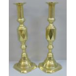 A pair of 19th Century Queen of Diamonds pattern brass candlesticks, 30cm