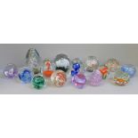 A collection of fifteen glass paperweights