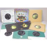 A collection of twelve The Beatles and related 7" singles including two EPs, Magical Mystery Tour,