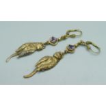 A pair of silver gilt and amethyst articulated cat earrings