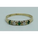 A yellow metal, emerald and diamond five stone ring, 1.3g