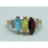 A 9ct gold and multi-gem set ring including Ethiopian opal, 2.2g, M, centre stone a/f