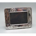 A small Art Nouveau silver photograph frame, 9cm x 7cm