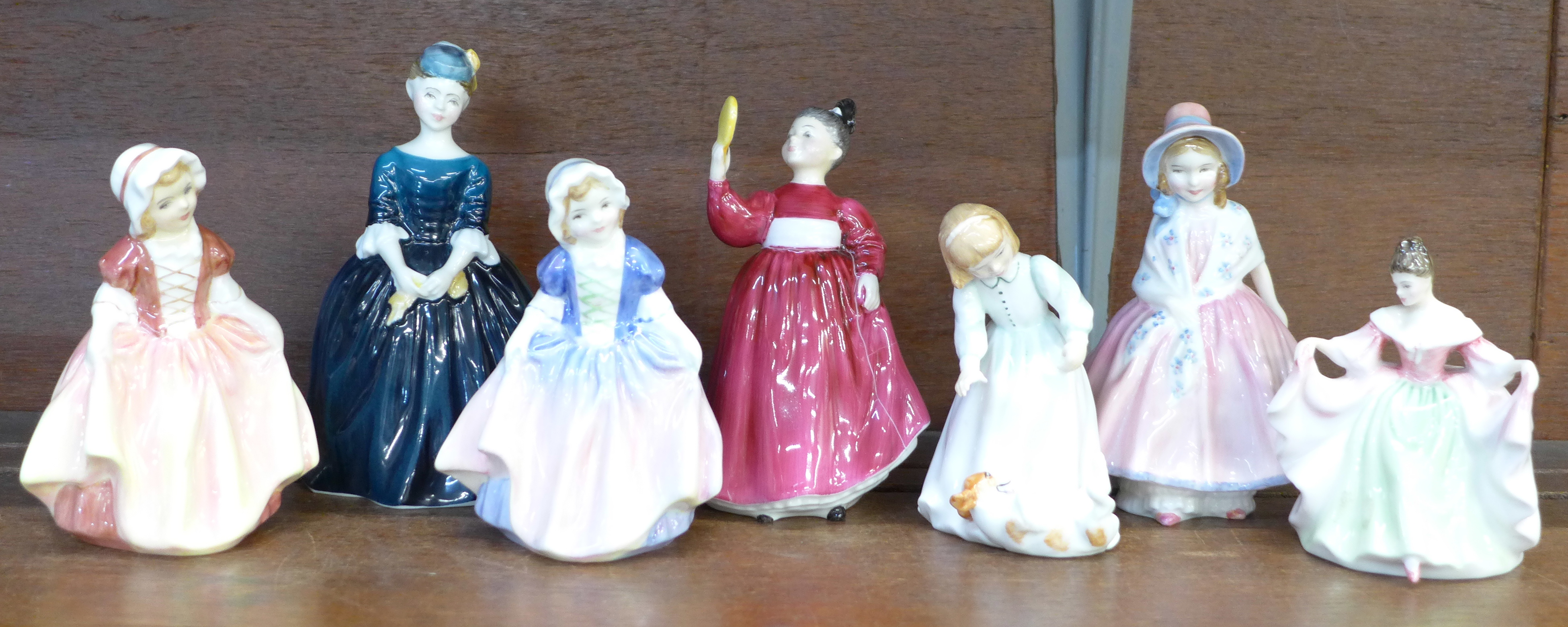 Seven Royal Doulton small figures; Let's Play, Dinky Do, Sara, Cherie, Vanity, a/f, Lily and Dinky