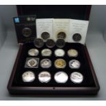 Nineteen commemorative £5 coins, in a box