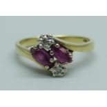 A 14ct gold, red stone and diamond four stone ring, 2.7g, N