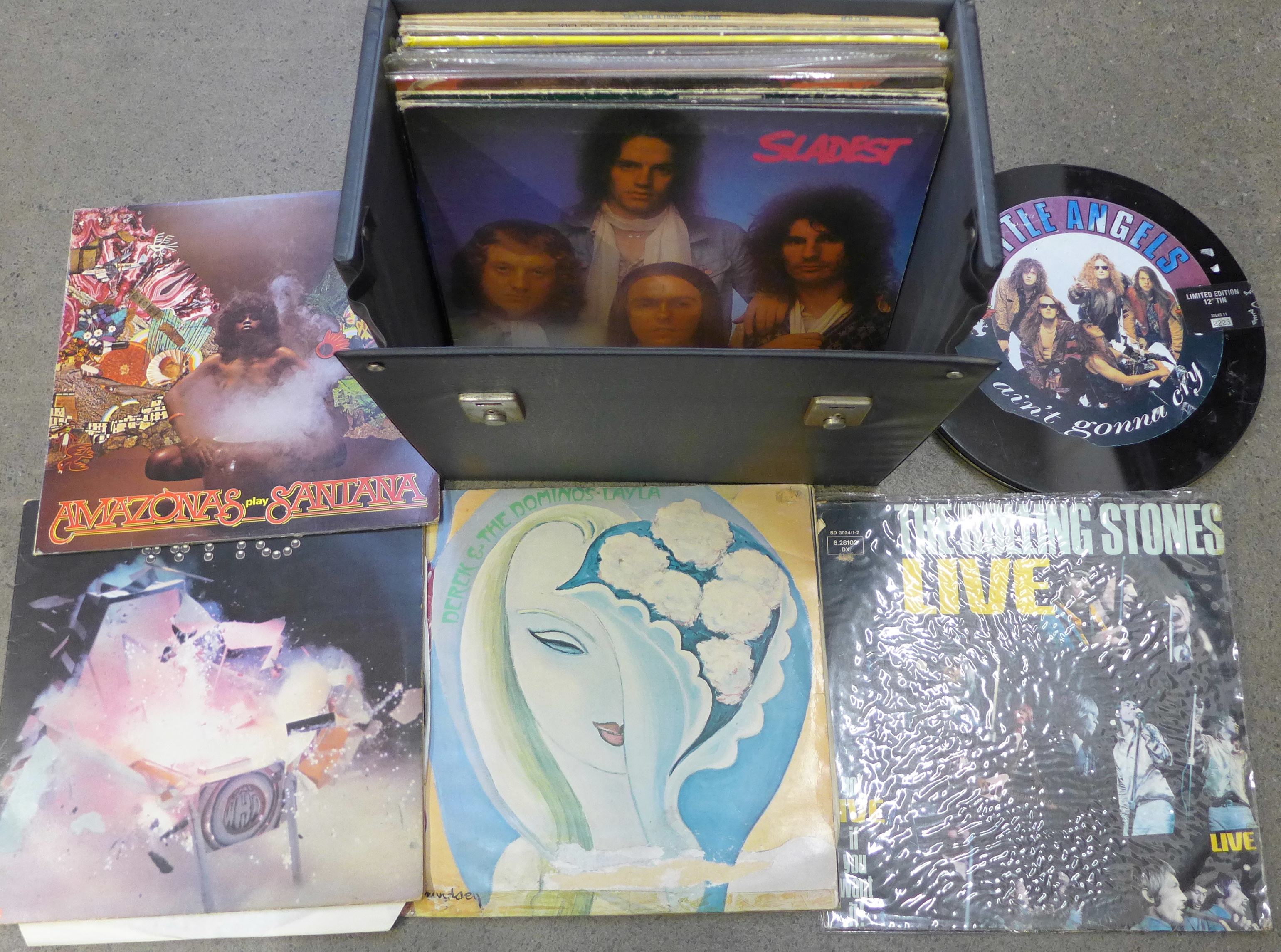 Twenty-two rock LP records, The Rolling Stones, The Who, T-Rex, etc.