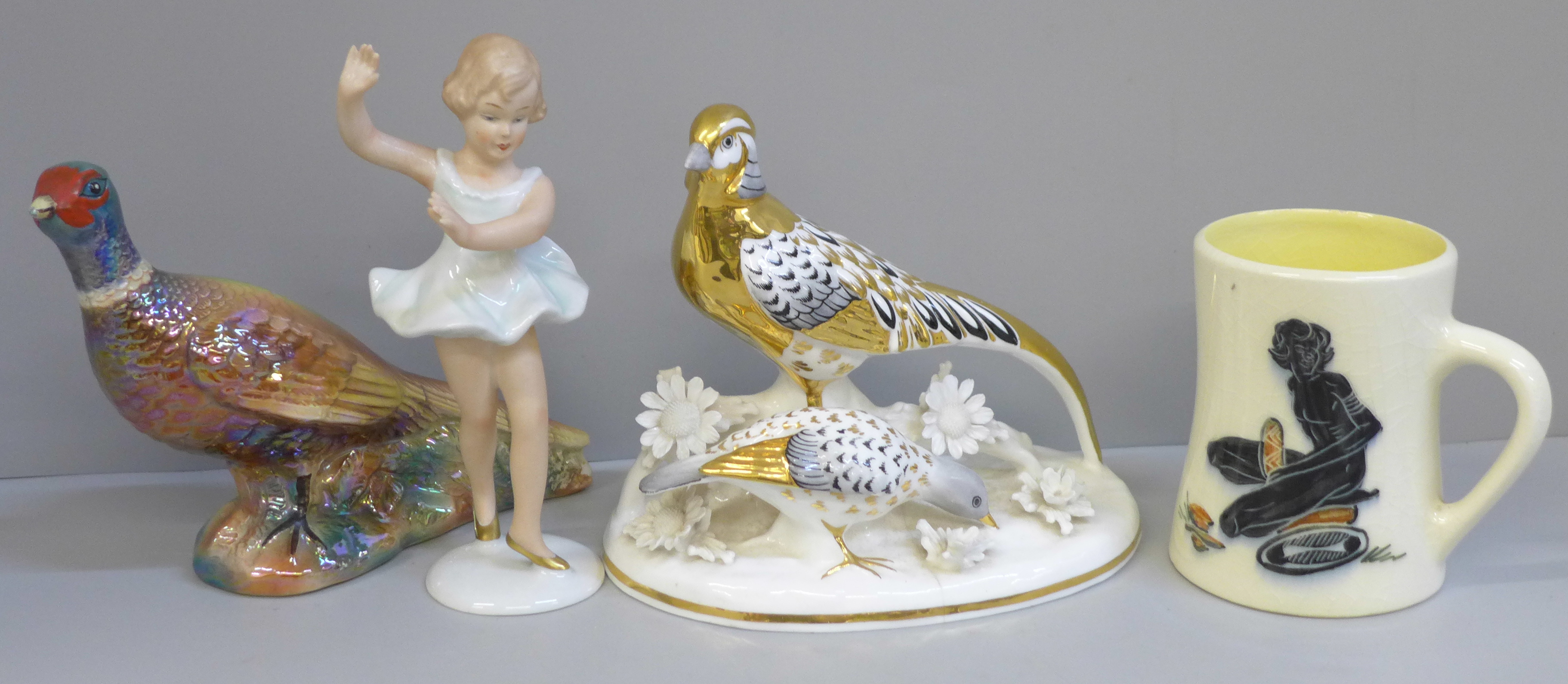 A KSP model of a pheasant, a small German porcelain figure of a dancer, a Staffordshire figure of