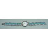 A lady's silver wristwatch with turquoise set bracelet and mother of pearl dial