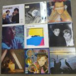 Twelve 1980s LP records including The Jam, U2, Kate Bush, Sade, Roxy Music, etc.