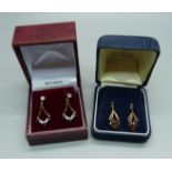 Two pairs of 9ct gold earrings, garnets and sapphire and white stones