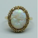 An 18ct gold, opal and white stone set ring, extensive damage to stone, 4.1g, O