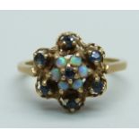 A 9ct gold cluster ring set with sapphires and opals, 2.5g, M