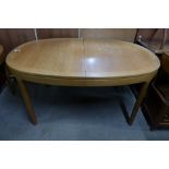 A Nathan teak extending dining table