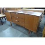 An Austin Suite teak concave sideboard