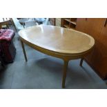 A Nathan teak extending dining table