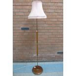A teak standard lamp