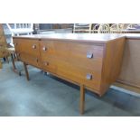 A Uniflex teak four drawer sideboard