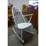 A white Ercol Quaker rocking chair