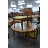 A Sutcliffe of Todmorden teak circular extending dining table and four teak dining chairs