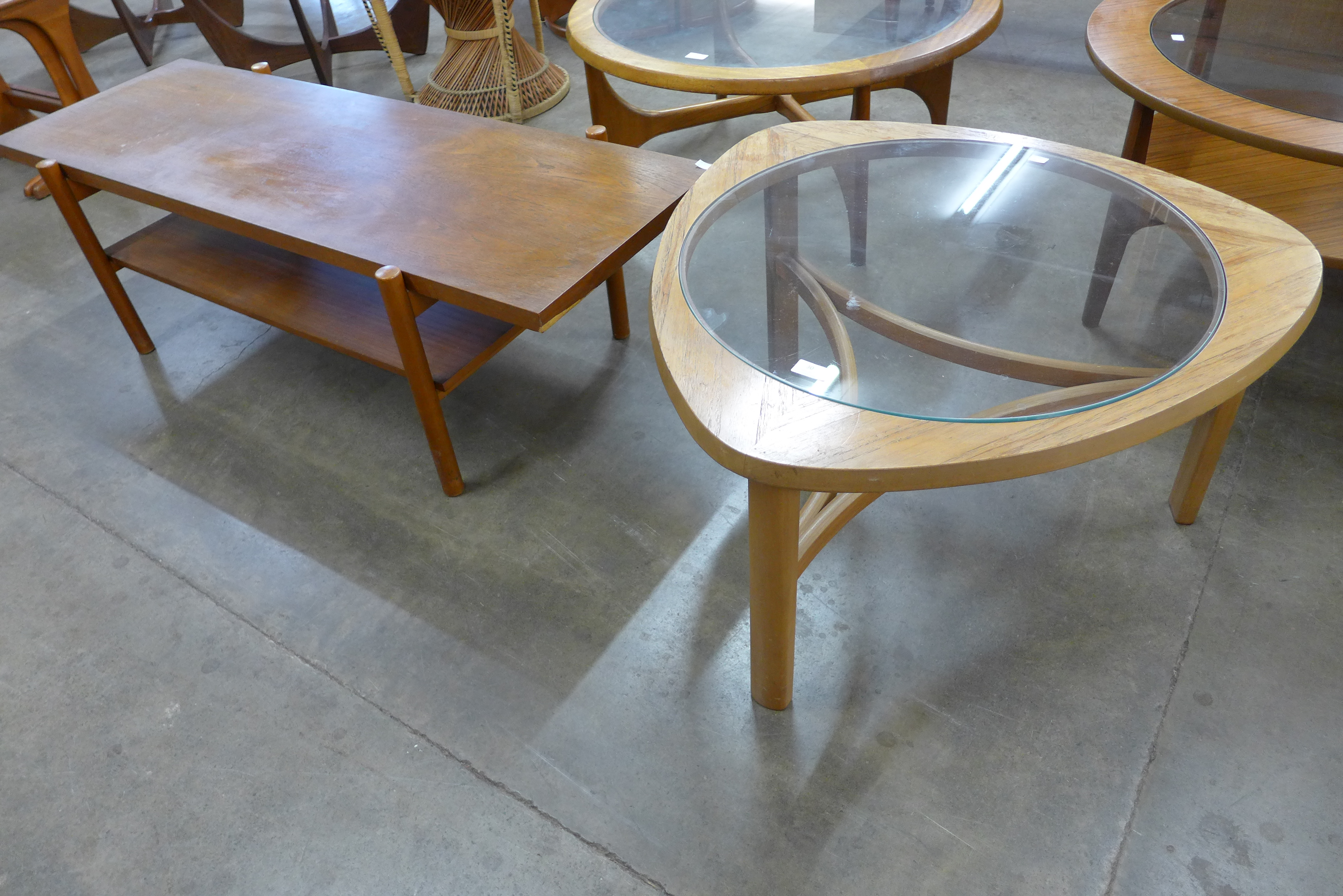 A Nathan teak and glass topped triangular coffee table and a rectangular teak coffee table