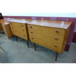 A pair of teak chests of drawers