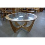 A G-Plan Astro teak and glass topped circular coffee table