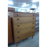 A teak chest of drawers