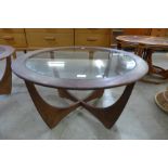 A G-Plan Astro teak and glass topped circular coffee table