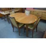 A G-Plan teak extending dining table and four chairs