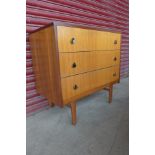 A teak chest of drawers