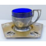 A WMF Art Nouveau cup and saucer with blue glass liner