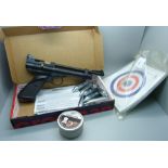 A Crosman .22 cal. target shooting pistol, boxed and with pellets