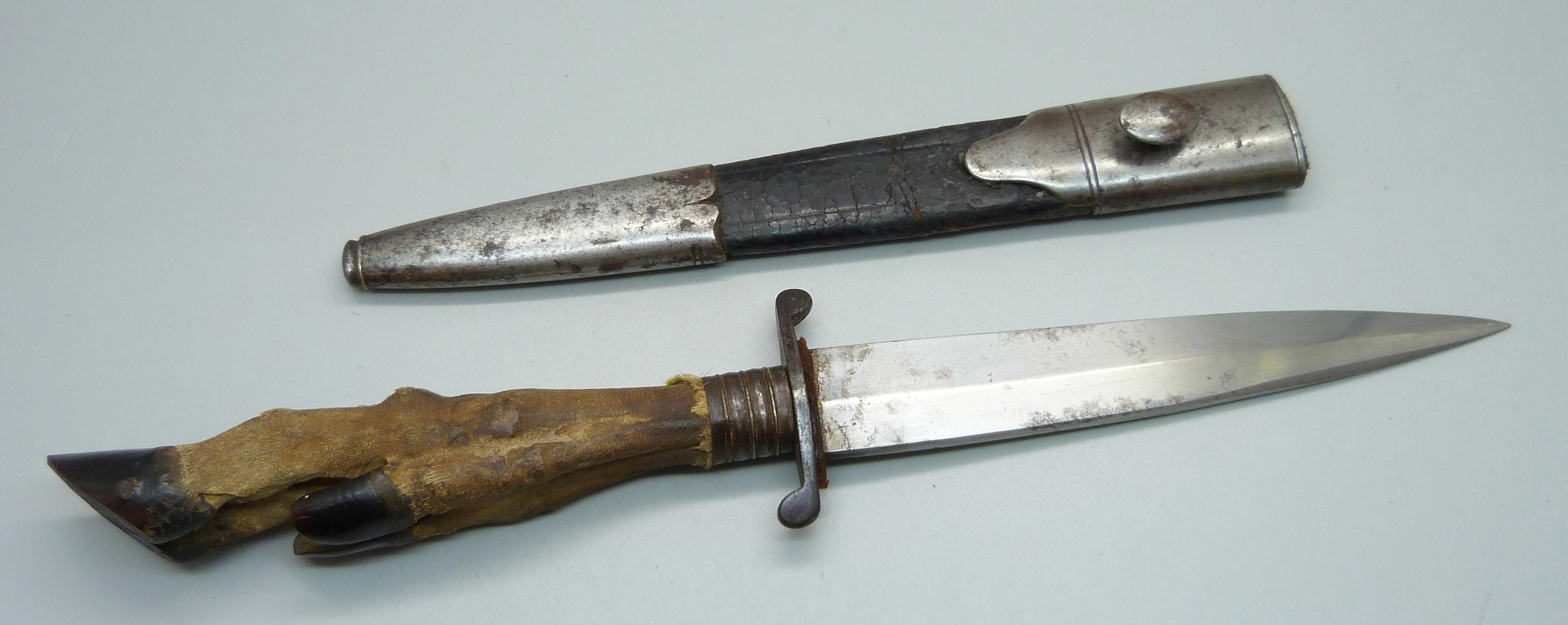 A German WWI trench knife with scabbard