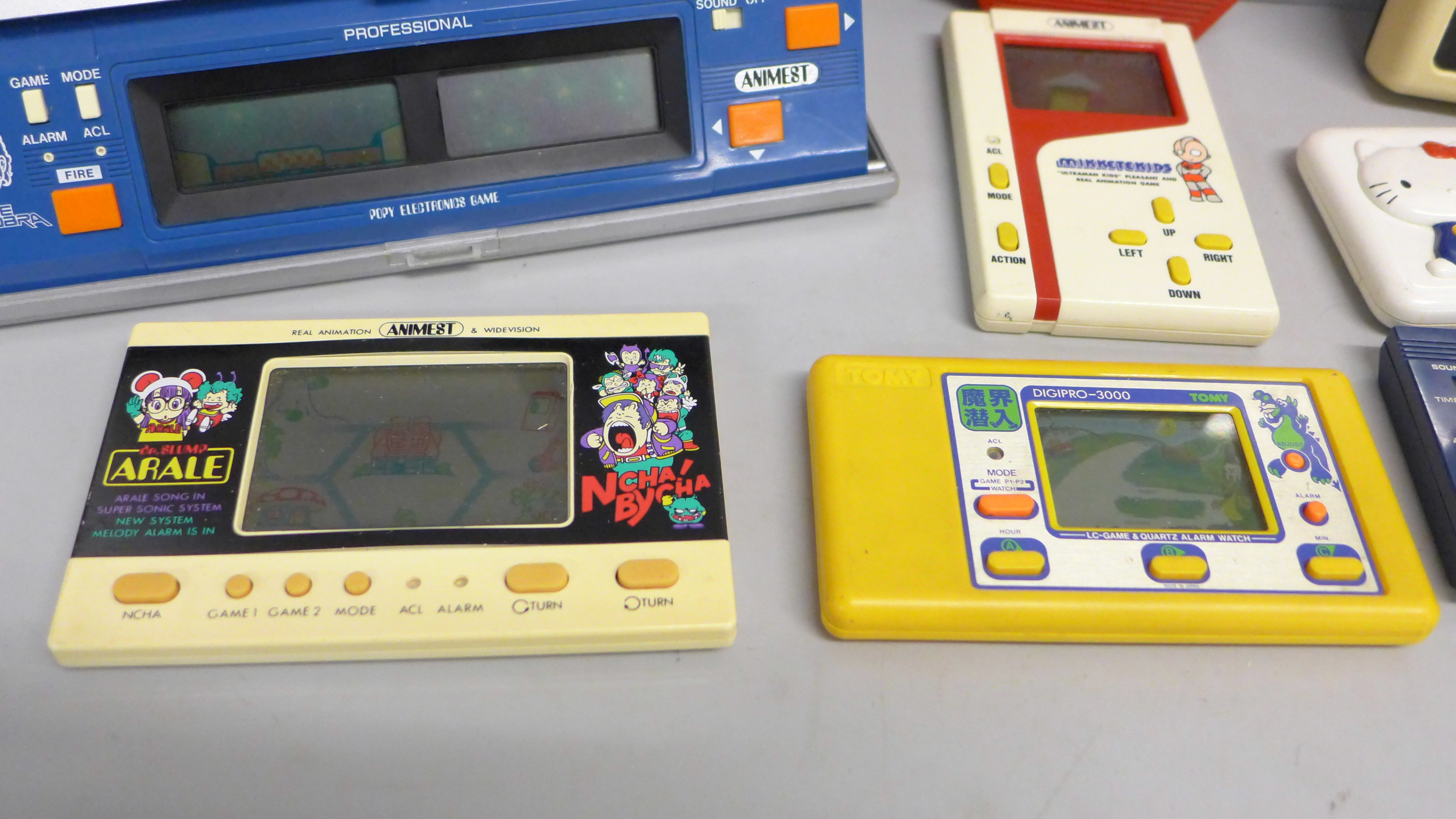 Eight vintage hand held games; Space Invaders, Animest Mikketekids, Bandai electronic basketball, - Image 3 of 3