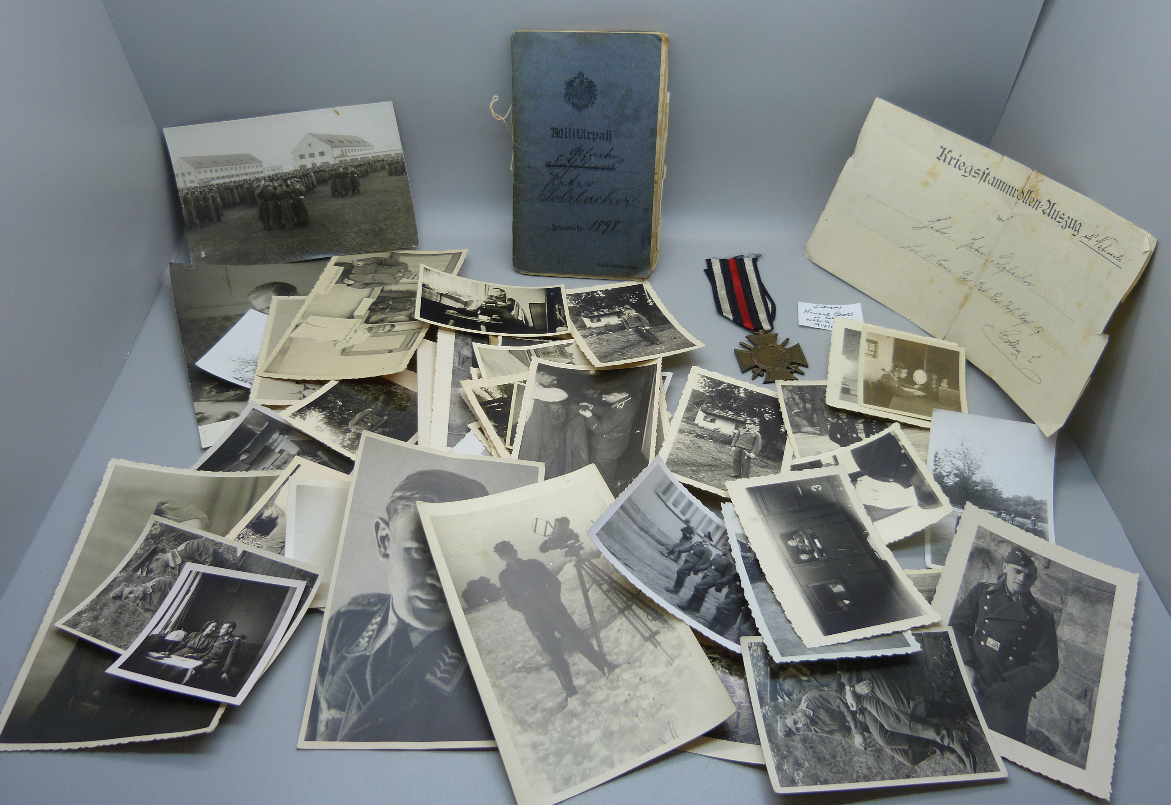 A German medal marked 1914-1918, plates, an early 20th Century service book and a collection of