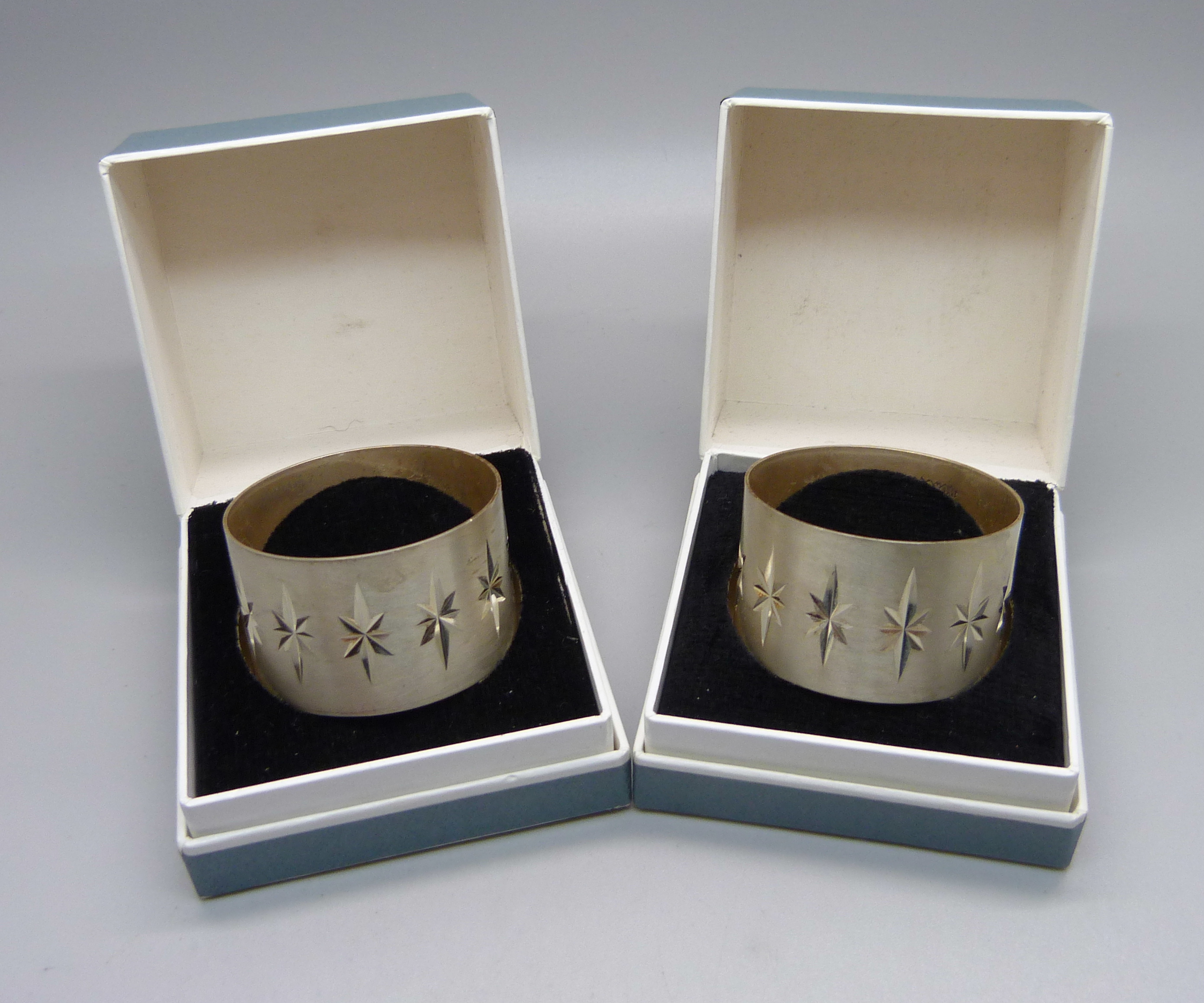 Two boxed silver napkin rings, 41g