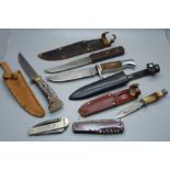 Six knives including a Pradel multi-tool knife, a knife marked Girl Guides, one with Scouts emblem