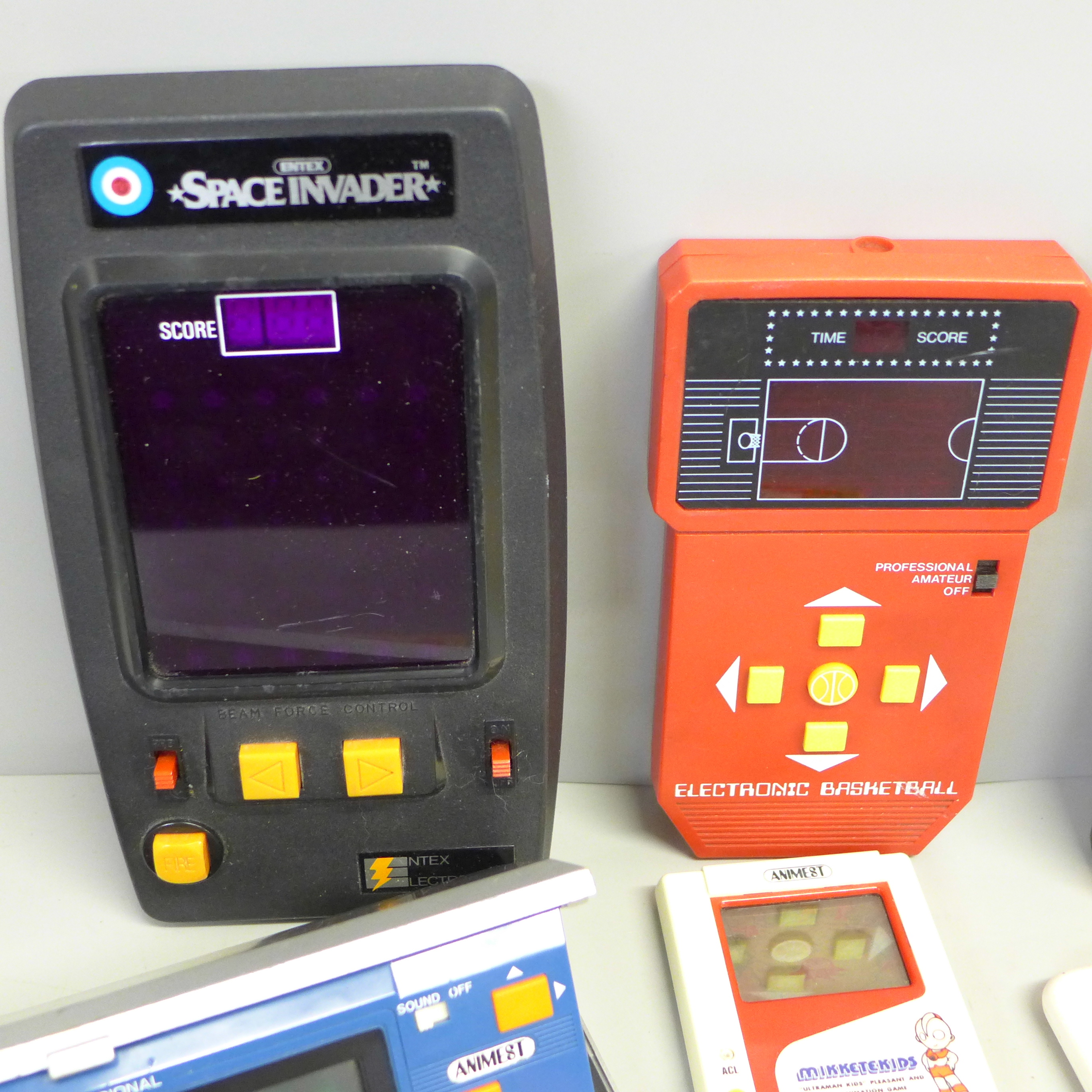 Eight vintage hand held games; Space Invaders, Animest Mikketekids, Bandai electronic basketball, - Image 2 of 3