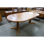 A Danish teak extending dining table