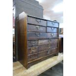 An early 20th Century oak twelve drawer index cabinet