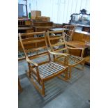 A pair of Parker Knoll teak rocking chairs