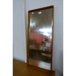 A rectangular teak framed mirror