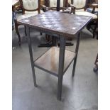 A carved hardwood and metal framed chess table
