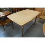 A Meredew teak extending dining table