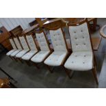 A set of seven Danish teak dining chairs